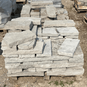 Stacked flat limestone stones at Whispering Hills Nursery.