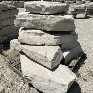 Stacked large natural stone rocks at Whispering Hills Nursery.