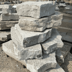 Stacked natural stone slabs at Whispering Hills Nursery.