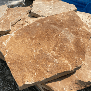Large natural flagstone with reddish-brown tones for landscaping.